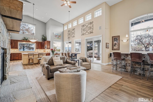 14245 Prairie Flower Ct, Reno, NV 89511 - living room featuring high vaulted ceiling, ceiling fan, light wood-style floors, healthy amount of natural light, and recessed lighting