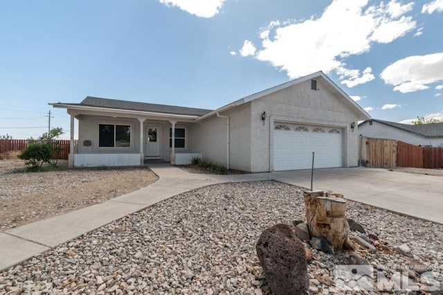 95 Hunter Park Way, Fallon, NV 89406 - ranch-style house with driveway, fence, an attached garage, a porch, and stucco siding