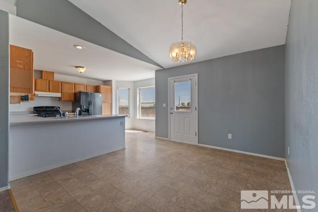 95 Hunter Park Way, Fallon, NV 89406 - kitchen featuring black refrigerator with ice dispenser, under cabinet range hood, a peninsula, a chandelier, and lofted ceiling