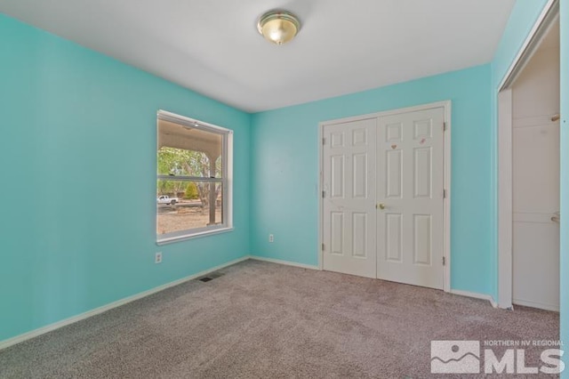 95 Hunter Park Way, Fallon, NV 89406 - unfurnished bedroom featuring carpet flooring, a closet, and baseboards