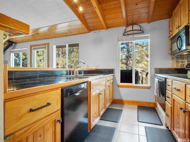 kitchen with black appliances, a sink, light tile patterned flooring, plenty of natural light, and wooden ceiling