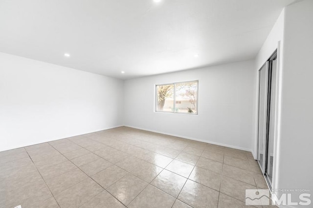 2441 Baxter, Sparks, NV 89431 - unfurnished bedroom with light tile patterned flooring, a closet, and recessed lighting