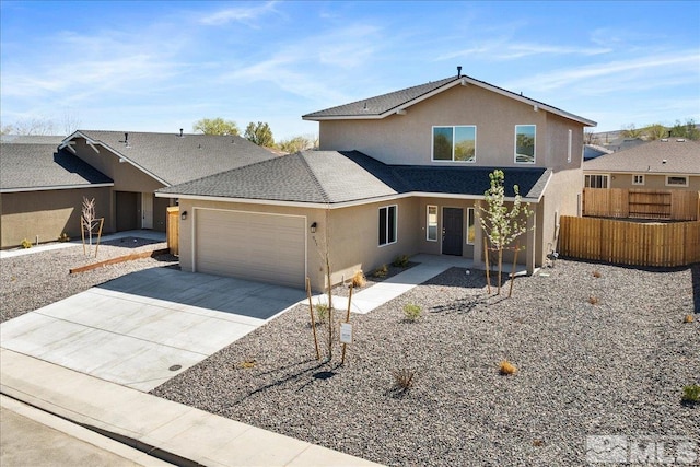 887 Agate, Fernley, NV 89408 - view of front of house with stucco siding, fence, an attached garage, driveway, and a shingled roof
