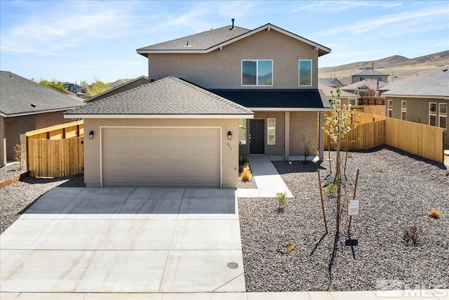 887 Agate, Fernley, NV 89408 - traditional home with roof with shingles, driveway, stucco siding, fence, and a garage