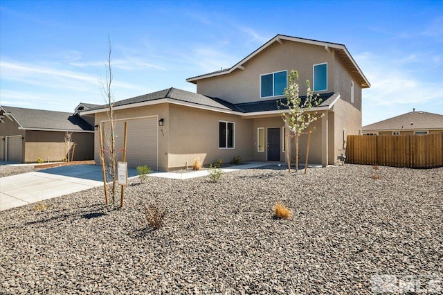 887 Agate, Fernley, NV 89408 - traditional home with stucco siding, fence, concrete driveway, and an attached garage