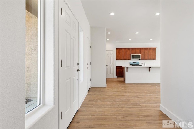 887 Agate, Fernley, NV 89408 - hallway featuring light wood-style flooring, recessed lighting, and baseboards
