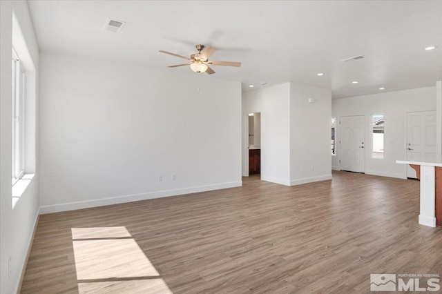 887 Agate, Fernley, NV 89408 - unfurnished living room with a ceiling fan, light wood-style floors, baseboards, and recessed lighting