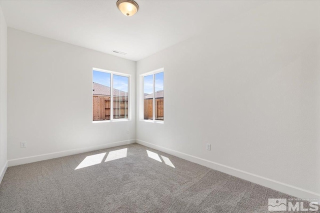 887 Agate, Fernley, NV 89408 - carpeted spare room with baseboards