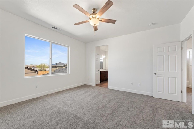 887 Agate, Fernley, NV 89408 - unfurnished bedroom featuring carpet, baseboards, ensuite bath, and ceiling fan