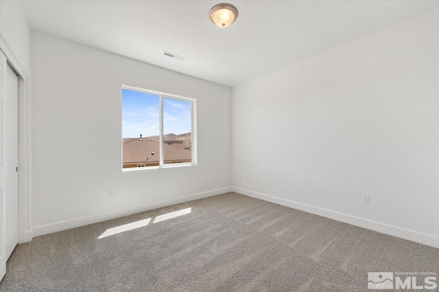 887 Agate, Fernley, NV 89408 - unfurnished bedroom featuring carpet flooring, baseboards, and a closet