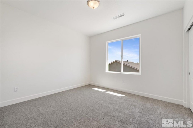 887 Agate, Fernley, NV 89408 - unfurnished bedroom featuring carpet floors and baseboards