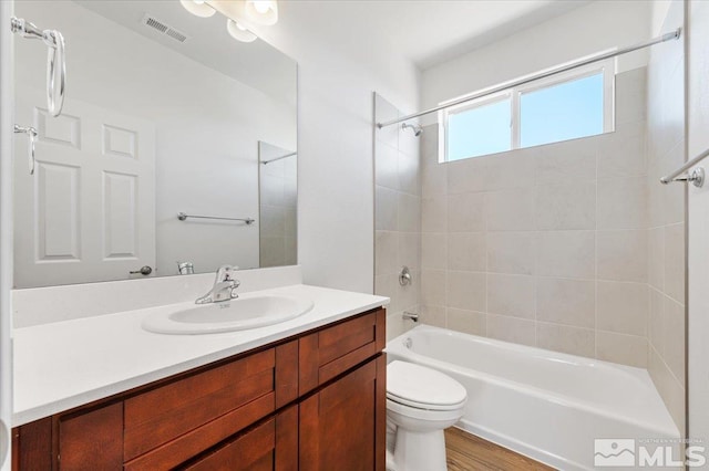 887 Agate, Fernley, NV 89408 - bathroom featuring shower / washtub combination, toilet, vanity, and wood finished floors