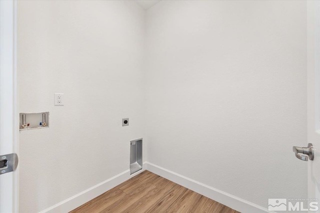 887 Agate, Fernley, NV 89408 - laundry room with electric dryer hookup, hookup for a washing machine, light wood-style floors, and baseboards