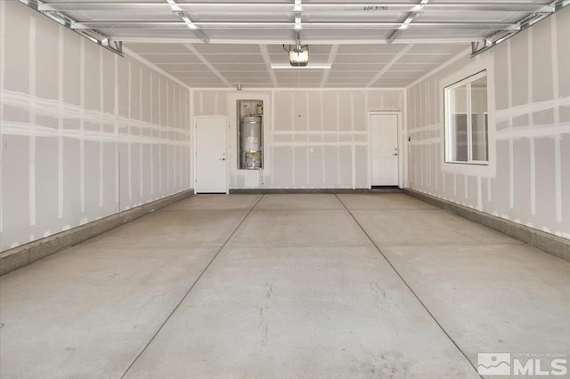 887 Agate, Fernley, NV 89408 - garage featuring strapped water heater and a garage door opener