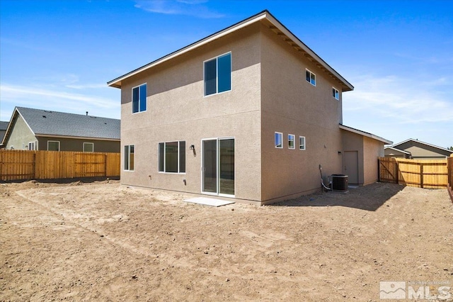 887 Agate, Fernley, NV 89408 - rear view of property with stucco siding, a fenced backyard, and central AC