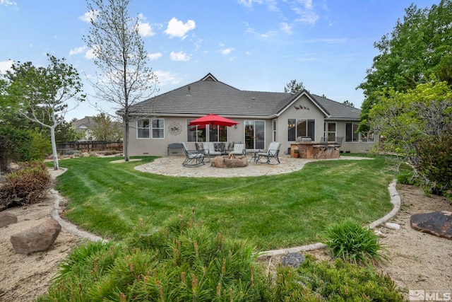 3463 White Mountain Ct, Reno, NV 89511 - rear view of property featuring a patio area, stucco siding, and an outdoor fire pit