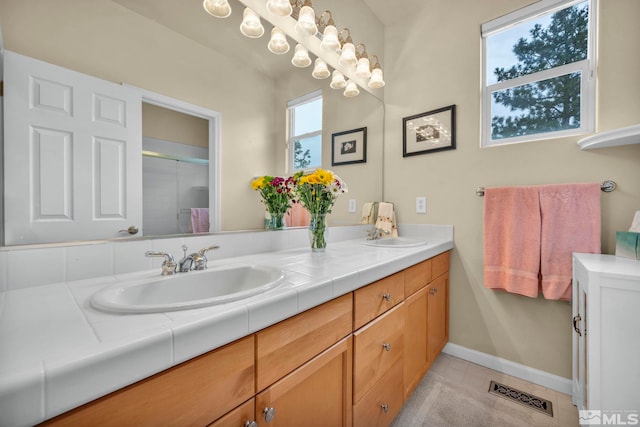3463 White Mountain Ct, Reno, NV 89511 - full bath featuring double vanity, an enclosed shower, baseboards, and tile patterned flooring