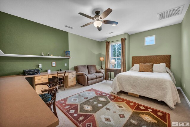3463 White Mountain Ct, Reno, NV 89511 - bedroom with a desk, light colored carpet, and a ceiling fan