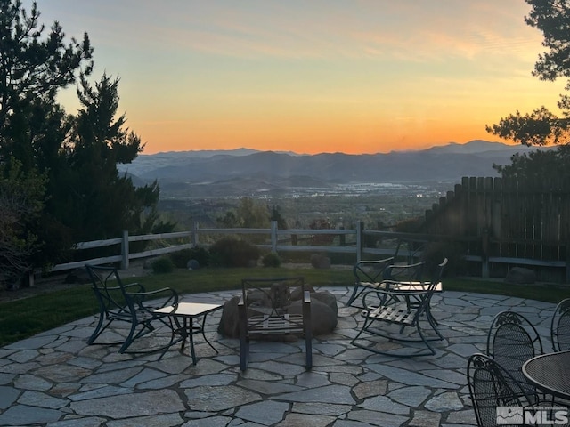 3463 White Mountain Ct, Reno, NV 89511 - patio terrace at dusk featuring a patio area and a mountain view