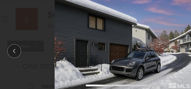 1308 Cave Rock Dr Unit C, Glenbrook, NV 89413 - view of snowy exterior featuring a garage