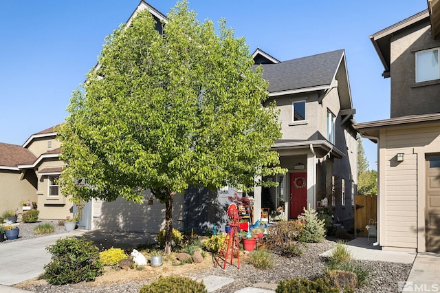 958 Marble Hills Cir, Sparks, NV 89436 - view of property hidden behind natural elements with concrete driveway, a garage, and a shingled roof