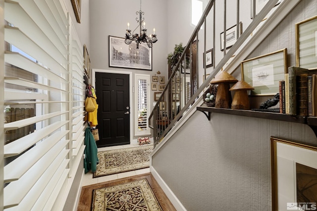 958 Marble Hills Cir, Sparks, NV 89436 - foyer with a chandelier, stairs, a high ceiling, and baseboards