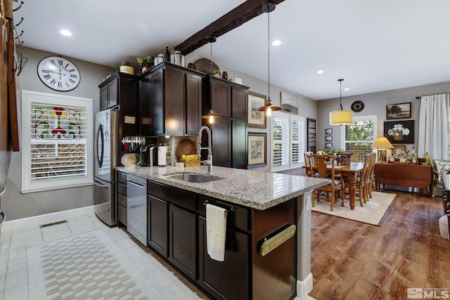 958 Marble Hills Cir, Sparks, NV 89436 - kitchen with a sink, appliances with stainless steel finishes, light stone counters, dark brown cabinetry, and recessed lighting