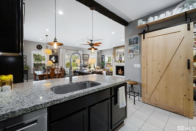 958 Marble Hills Cir, Sparks, NV 89436 - kitchen featuring a sink, a barn door, dark cabinets, dishwasher, and recessed lighting