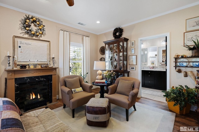 958 Marble Hills Cir, Sparks, NV 89436 - sitting room featuring light wood-style floors, crown molding, a fireplace, recessed lighting, and ceiling fan
