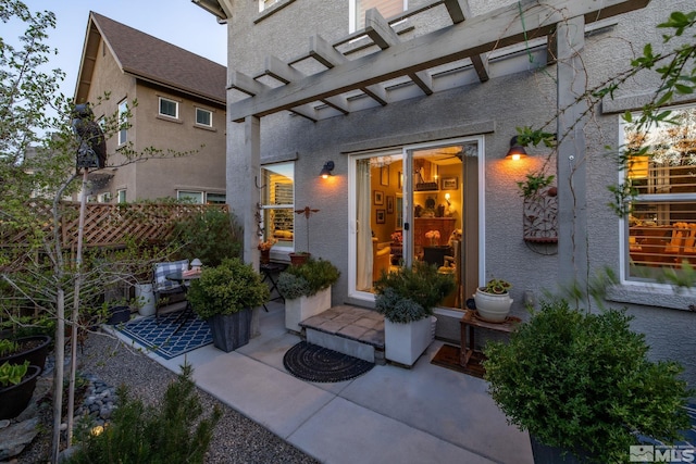 958 Marble Hills Cir, Sparks, NV 89436 - doorway to property featuring a patio, fence, and stucco siding