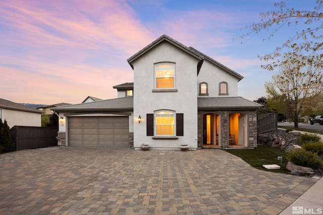 7150 Provence Cir, Reno, NV 89523 - french country home with decorative driveway, stucco siding, an attached garage, and stone siding