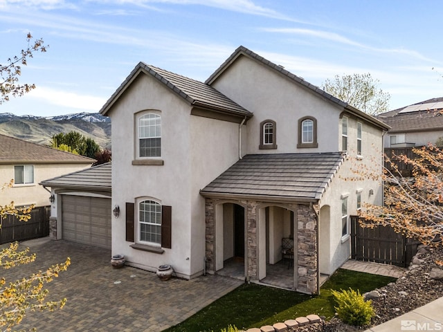 7150 Provence Cir, Reno, NV 89523 - view of front of home with fence, stucco siding, decorative driveway, and an attached garage
