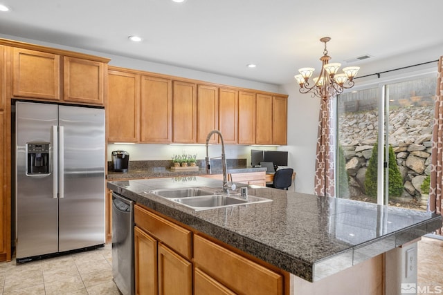 7150 Provence Cir, Reno, NV 89523 - kitchen featuring stainless steel appliances, a sink, a center island with sink, recessed lighting, and a chandelier