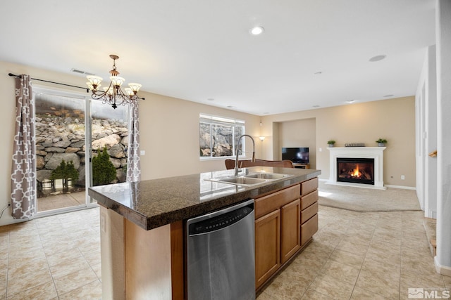 7150 Provence Cir, Reno, NV 89523 - kitchen with dishwasher, a sink, a warm lit fireplace, dark countertops, and a chandelier