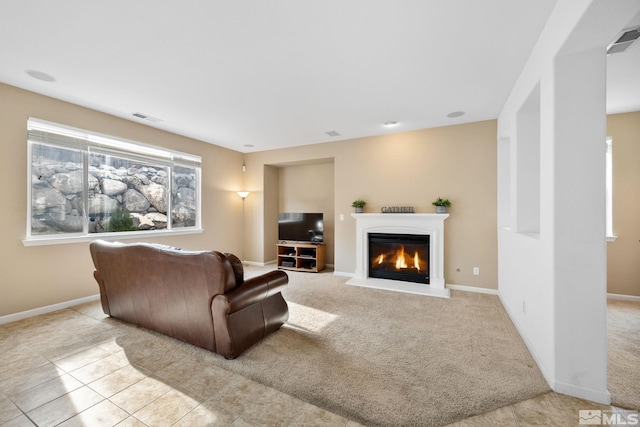7150 Provence Cir, Reno, NV 89523 - living room featuring a glass covered fireplace and baseboards