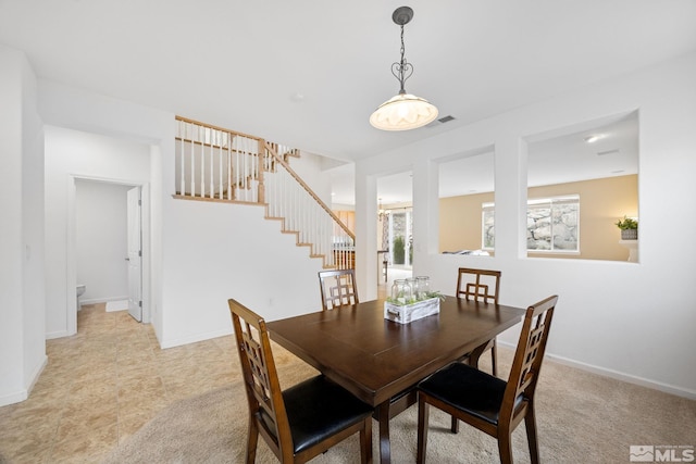 7150 Provence Cir, Reno, NV 89523 - dining area featuring stairway and baseboards