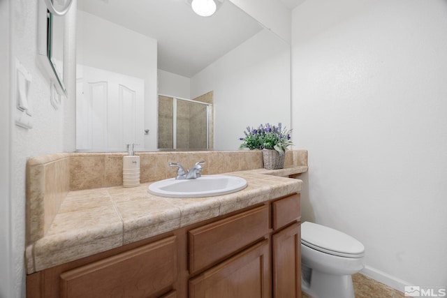 7150 Provence Cir, Reno, NV 89523 - bathroom featuring a stall shower, vanity, toilet, and baseboards