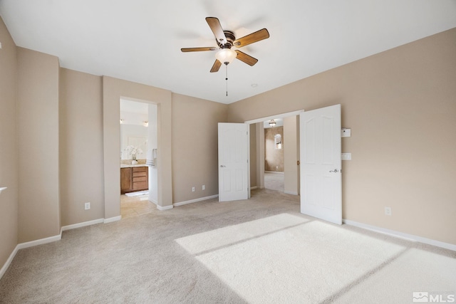 7150 Provence Cir, Reno, NV 89523 - unfurnished bedroom featuring light carpet, baseboards, ensuite bath, and a ceiling fan