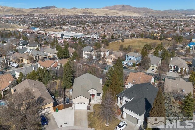 4531 Pyramid Peak Cir, Sparks, NV 89436 - aerial view of property and surrounding area with nearby suburban area and a mountain backdrop