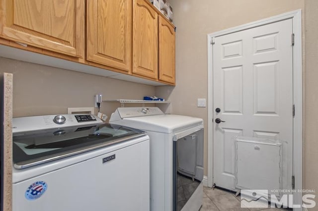 4531 Pyramid Peak Cir, Sparks, NV 89436 - clothes washing area featuring washing machine and clothes dryer, cabinet space, and light tile patterned floors