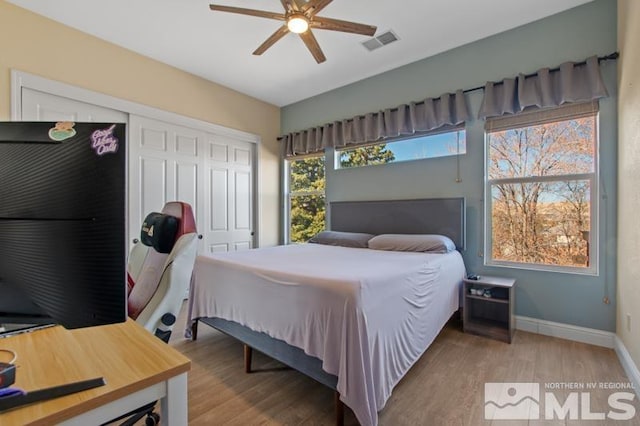 4531 Pyramid Peak Cir, Sparks, NV 89436 - bedroom featuring wood finished floors, a closet, baseboards, and a ceiling fan