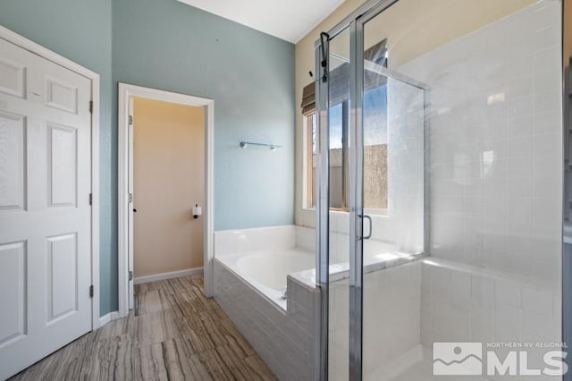 4531 Pyramid Peak Cir, Sparks, NV 89436 - full bath featuring a garden tub, a shower stall, and baseboards
