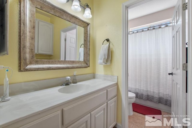 4531 Pyramid Peak Cir, Sparks, NV 89436 - bathroom with toilet, vanity, tile patterned flooring, and shower / tub combo