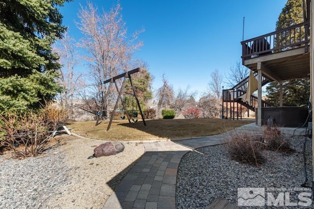 4531 Pyramid Peak Cir, Sparks, NV 89436 - view of grassy yard featuring stairway, a playground, and a deck