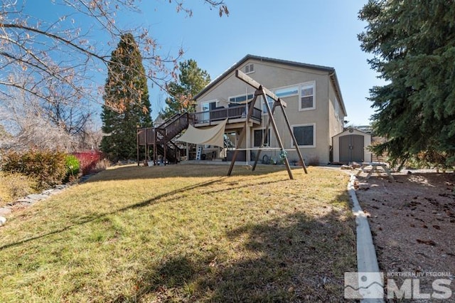 4531 Pyramid Peak Cir, Sparks, NV 89436 - rear view of property with stairway, a storage unit, an outbuilding, a yard, and a wooden deck