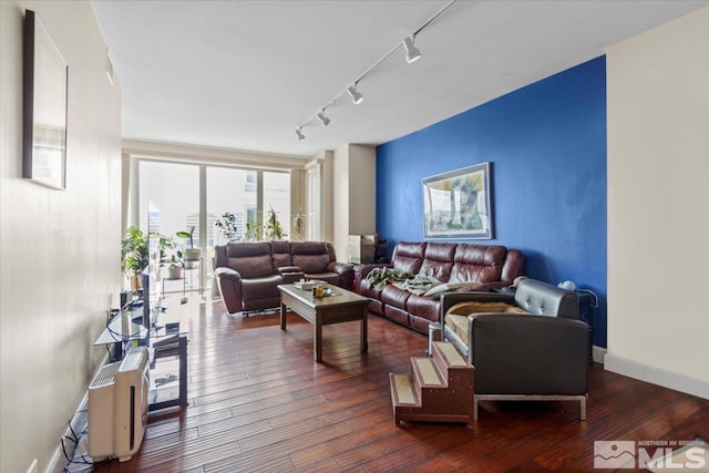 50 N Sierra St Unit 1109, Reno, NV 89501 - living area featuring track lighting, dark wood-style floors, and baseboards