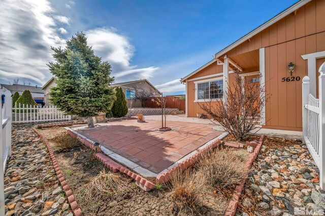 5620 Tassel Dr, Sun Valley, NV 89433 - fenced backyard with a patio