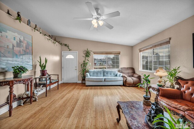 5620 Tassel Dr, Sun Valley, NV 89433 - living room with wood-type flooring, vaulted ceiling, ceiling fan, and baseboards