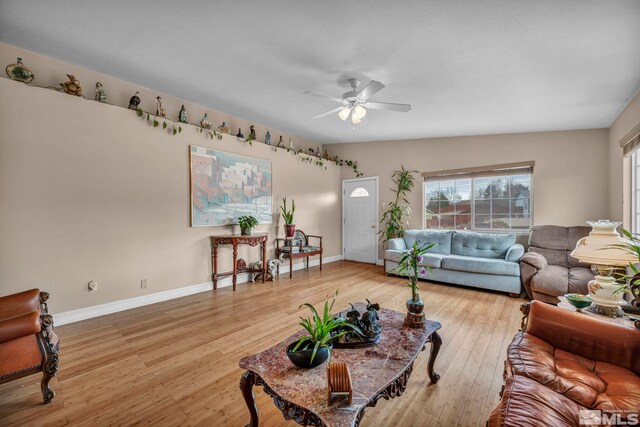 5620 Tassel Dr, Sun Valley, NV 89433 - living room featuring healthy amount of natural light, ceiling fan, and baseboards