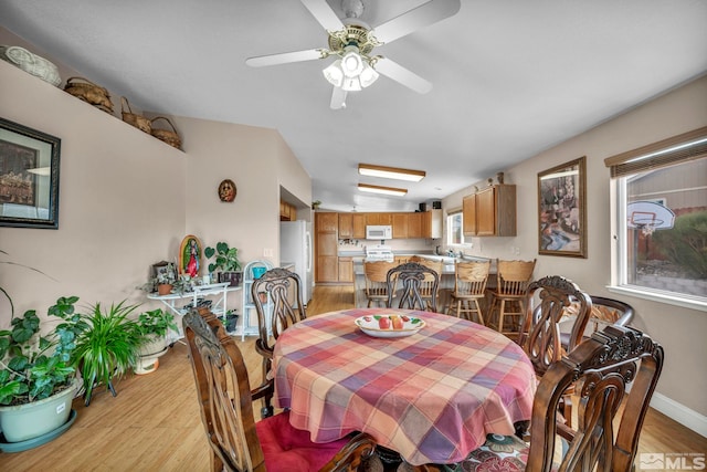 5620 Tassel Dr, Sun Valley, NV 89433 - dining space with light wood-style floors and a ceiling fan